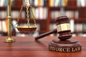 A gavel rests on a block that reads Divorce Law, representing the process to file for an uncontested divorce.