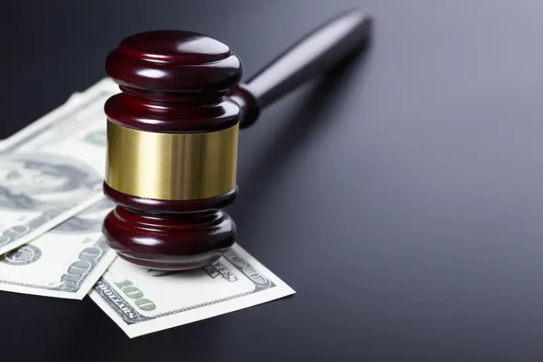 Spousal support is represented by a gavel on top of cash.
