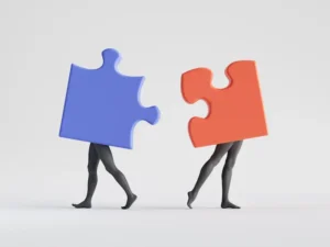 Two puzzle pieces with mannequin legs step apart from one another, representing how to keep divorce simple.