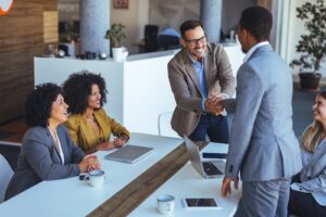 Business Colleagues Shaking Hands at Meeting